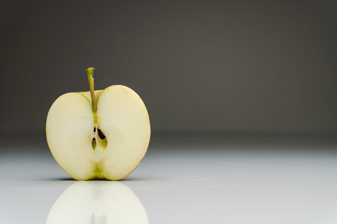 a half eaten apple sitting on top of a table