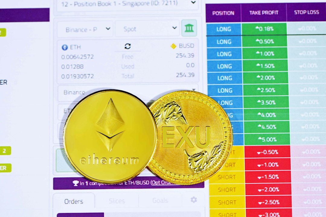 gold round coin on white paper