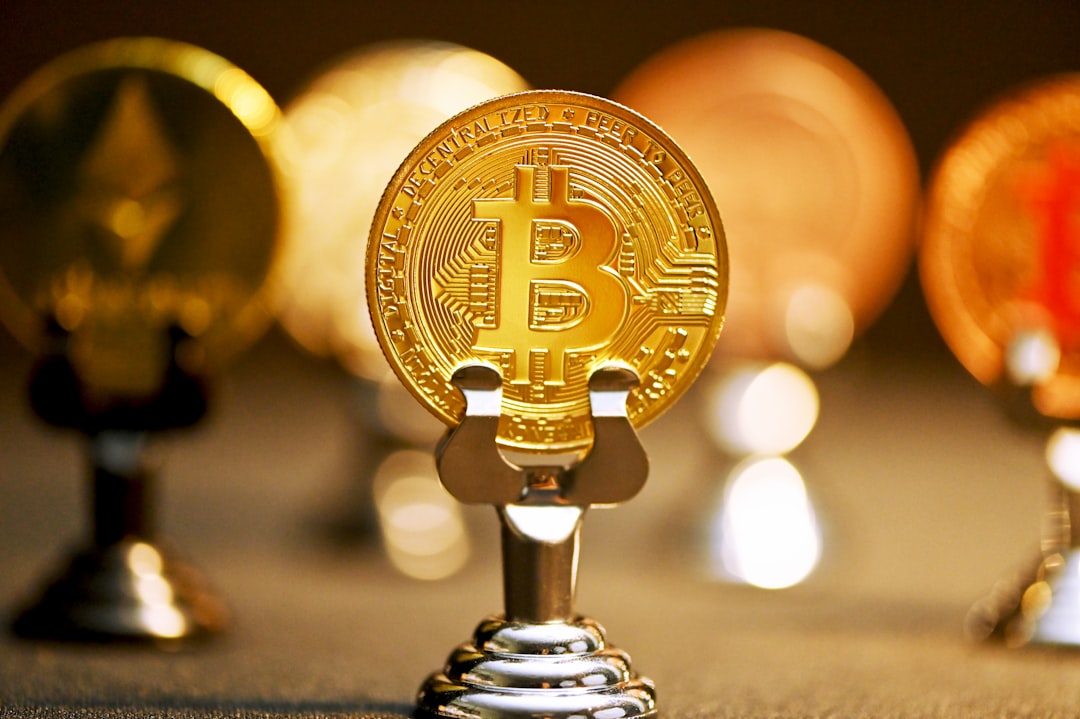 a bitcoin on a stand in front of other bitcoins